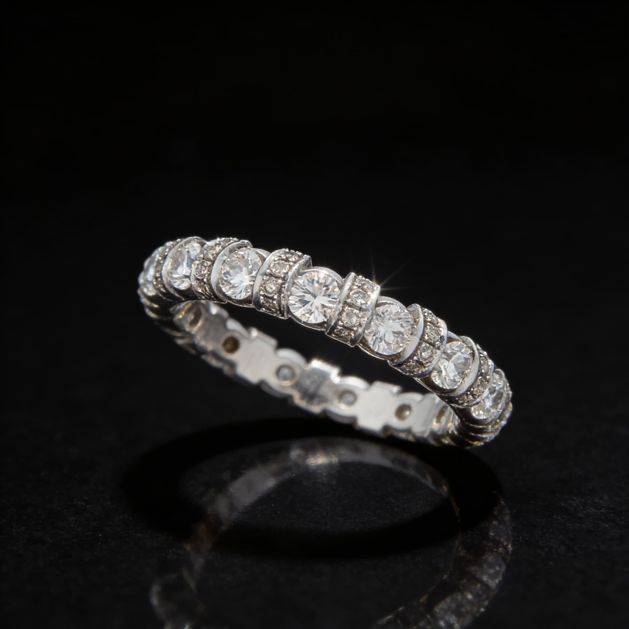 The Eternità Four-Prong Round Diamond Eternity Ring with Pavé Spacers - 4