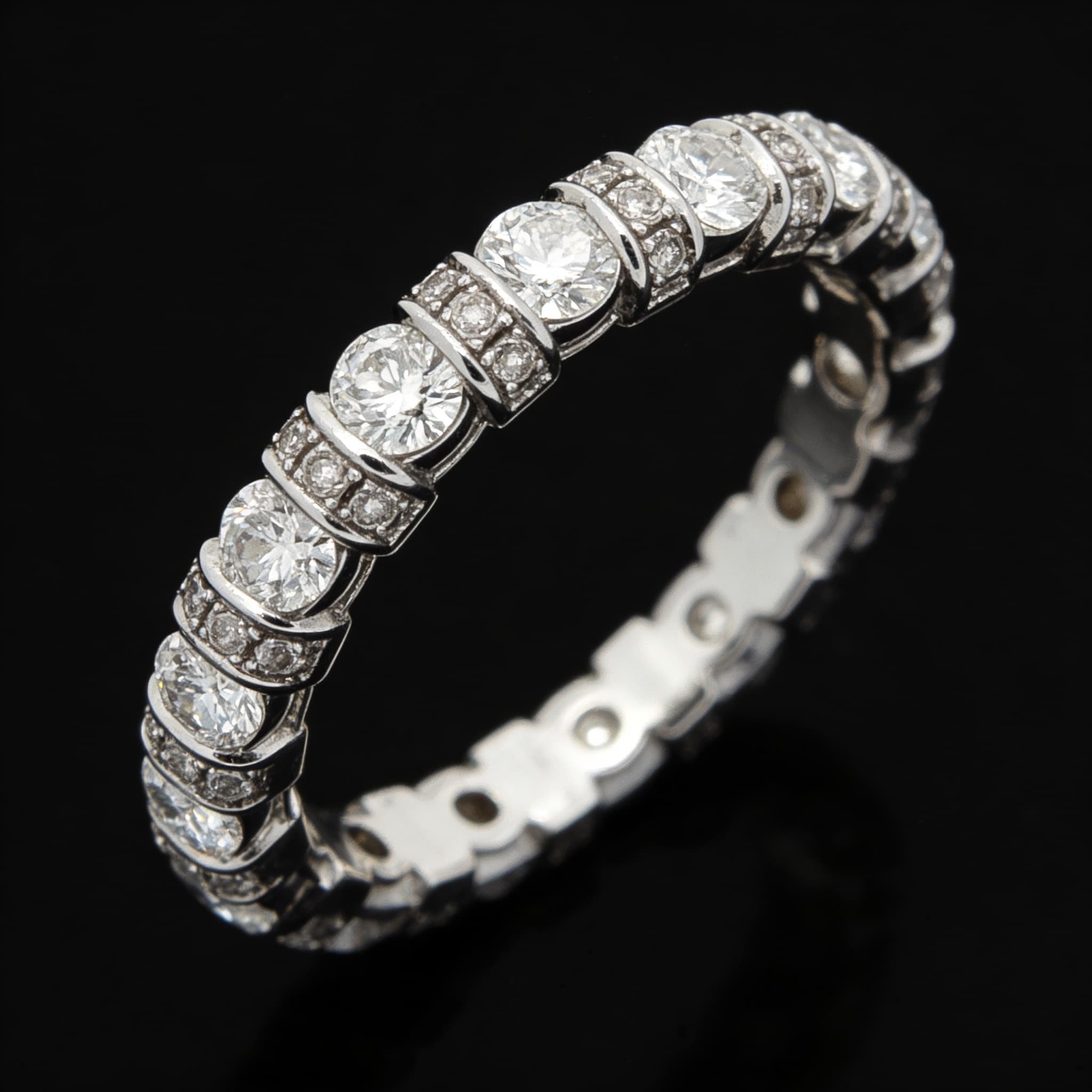 The Eternità Four-Prong Round Diamond Eternity Ring with Pavé Spacers - 5